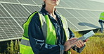 Woman at solar panel farm with tablet for clean energy, outdoor electricity grid maintenance and check. Sustainability, photovoltaic power system and technician with helmet for safety inspection.