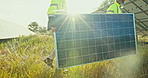 Teamwork, men carrying solar panel for installation in clean energy and outdoor electricity maintenance. Sustainability, collaboration and technician helping contractor with photovoltaic power system