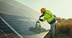 Solar, renewable energy and an engineer man on a farm to install a panel for sustainability or infrastructure. Construction, industry and electricity with a technician outdoor in a green countryside