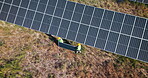 Drone, engineering or people with solar panels outdoor for renewable energy, clean electricity or sustainability. Aerial view, employees or photovoltaic in a farm or nature for maintenance or work
 
