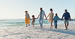 Holding hands, love and big family walking at the beach with freedom, fun and bond. Travel, nature and children with parents and grandparents at the ocean for summer, holiday or vacation at the sea