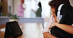 Headphones, share and brother hugging his sister to share tablet streaming for entertainment in their home together. Love, family or children with a boy and girl embracing while watching a video