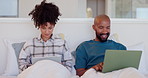 Bedroom, home and couple with a laptop, tablet and search internet with website information, conversation and relax. Bed, black man and woman with pc, technology and talking with app, typing or smile