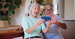 Senior man, woman and smartphone in video call with wave, communication and connect in living room. Mature couple, technology and talking with virtual chat, live streaming and online in family home