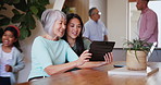 Happy, senior mother and daughter on tablet in home, social media or internet on digital app, reading email and online website. Asian mom, adult woman and technology, family bonding together or talk