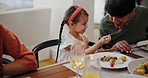 Kid, grandmother and family dinner for feeding in home of food, fork and plate with playful expression. Woman, little girl and bonding at table with healthy, meal or diet for nutrition, love and care