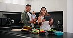 Baby, tablet and a couple cooking in the kitchen of their home together for health, diet or nutrition. Love, smile or happy with a mother, father and infant child reading a recipe on a technology app