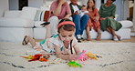 Kid, girl and playing with toys in living room for mobility, development or game in family home. Youth, child and animals for learning, education or knowledge for plastic reptile for fun by alone