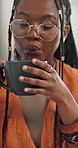 Woman, coffee and hot steam blowing for cold morning drink, comfort or breakfast latte. Black person, tea cup and or warm beverage for winter day or weekend relax for holiday peace, lunch or thirsty
