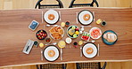 Food, healthy and top view of breakfast on the table with waffles, coffee and fruit at home. Meal, wellness and gourmet diet dinner or supper on wood in dining room of modern apartment or house.