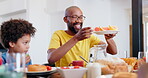 Father, child or lunch with fruit at table, for healthy nutrition or diet with happiness in family home. African dad, parents or son with grapefruit, vitamin c or meal for health wellness at dinner