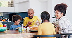 Kids, food and family eating breakfast together in the kitchen of their home together on the weekend. Smile, love and children with their happy parents in an apartment for health, diet or nutrition