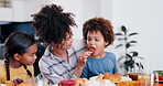 Woman, food and feeding the kids, love and sharing breakfast or eating together. Happy mother and son, nutrition and strawberry for vitamins, healthy meal and fruit or love, wellness and smile