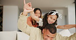 Family, airplane and parents with kid in home, care and play together in living room. Smile, mother and father piggyback child on sofa, plane game and freedom to relax with girl, connection and love