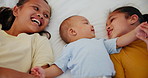 Children, love and sisters with their baby brother in the bedroom of their home together from above. Family, smile or happy with girl kids and an infant boy playing on a bed for morning bonding