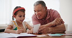 Writing, homework card and girl with grandfather for education, learning and studying together in home. School, family and young child with grandparent for teaching, knowledge and help with test