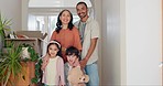 Parents, kids and moving in new home, face and smile with pride, investment and real estate with fresh start. Father, mother and children in family house, happy and excited in portrait for property