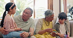 Grandparents, children and conversation in home living room, playing with toys and bonding. Senior woman, man and happy kids talking on couch, story and care, love and connection of family together