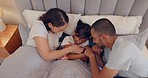 Father, mother or child in bed to play in a house with love, smile or freedom in a happy family. Relax, top view or funny mom with dad enjoying having fun for bonding, tickling or laughing together