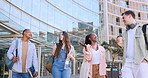 Students, friends and happy on walk at university with diversity, funny conversation or chat in sunshine. Men, women and talking with comic joke, story or college for education, learning and studying