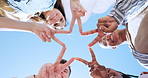 Friends group, star fingers and circle together for smile, face or connection with icon at university. Men, women and solidarity with emoji, sign or diversity for care, support or low angle at campus