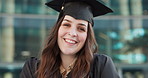 Face, outdoor and woman with graduation, education and celebration with cap, scholarship or university. Portrait, person and academic with student, happiness or achievement with degree and college