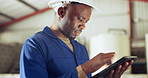 Black man, tablet and engineer at warehouse for research, maintenance or inspection on site. African male person, contractor or technician working on technology in online search or monitoring factory