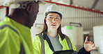 Tablet, industry and a construction worker team talking in a warehouse for planning or discussion. Diversity, communication and engineer team together in a plant or factory for manufacturing safety