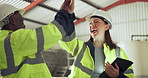 Teamwork, high five and construction worker people laughing in a warehouse for success. Diversity, smile and support with an engineering team together in a plant for the celebration of a target