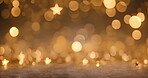 Christmas, New Year, birthday celebration background with gold stars. Announcement holiday invitation with blurred, bokeh movement. Copyspace decorations with glitter, confetti and texture.
