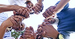 Hands, prayer and a black family in a circle together from below for faith, religion or belief. Support, trust or hope children, parents and grandparents in a circle for bonding, unity or solidarity