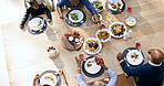 Family eating lunch, garden and top view for thanksgiving with bonding, care or love for celebration. Black people, patio and brunch at table for party, event or conversation for meat, kids or diet