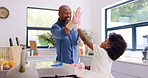 Family, cleaning and high five with child in home for learning hygiene with gloves, cloth and wipe. Kid, helping and dad with disinfecting spray with bacteria in kitchen, counter or surface in house