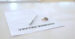 Divorce papers, rings and pen for agreement, family law and breakup for relationship issues. Lawyer, paperwork and document for marriage, contract and legal certificate on table, settlement and civil