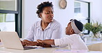 Child disturb mother on laptop for remote work, angry and girl wants attention in home at table. African mom, freelancer and kid distract woman on computer, stress and frustrated,  tired and noise