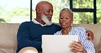 Home, old couple on a couch and tablet with connection, digital app and conversation in a lounge. House, senior man and elderly woman with technology, contact and online with typing and social media