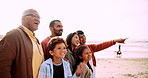 Happy, beach and big family looking together at the view on a summer vacation, holiday or adventure. Smile, bonding and children standing by ocean or sea with parents and grandparents on weekend trip