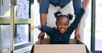 Father, girl and playing in box of new home for celebration or excited for real estate or relocation to property by front door. Black people, parents and children with happiness, cardboard or joyful
