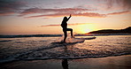 Girl child, silhouette and sunset at sea, playing and splash feet with freedom, water and vacation. Kid, ocean and beach with game in waves, jump and summer sunshine at dusk on holiday in Mexico