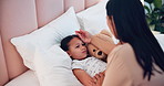 Mother, sick child in bed and checking fever in house, care and comfort with woman, kid and teddy bear. Illness, cold and girl in bedroom with mom for healthcare, recovery and support in homecare.