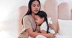 Sick child, mother and hug with thermometer, comfort and homecare, support with woman and kid in bed. Illness, stress and young girl in bedroom with mom, fever and checking temperature with embrace.