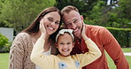 Parents, girl child and happy in garden, face and hug with love, bonding and outdoor in summer sunshine. Father, mother and daughter with care, portrait or smile in backyard, spring and family home