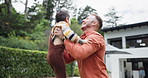 Dad, garden and lift boy in air for game, bonding and playing with love, happy and excited at family house. Father, child and throw with flight, care and outdoor together with laugh, home or backyard