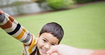 Person, boy and spin outdoor with pov, games and playful with smile, flight and love in summer sunshine. Father, son and happy with holding hands, backyard and holiday with bonding at family house