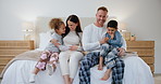 Face, children and mother and father in bedroom for love, bonding and loving relationship. Family, parents and portrait of mom, dad and young kids for playful, care and relax for childhood fun on bed