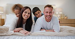 Love, face and family on bed happy, playful and bonding at home with smile, trust or support. Security, care and portrait of children with parents in a bedroom for hug, games or having fun in a house