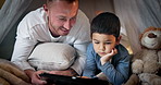 Tablet, child thinking and father with bedroom fort for social media, video or online gaming app at home. Website, dad and boy together with bonding, streaming and movie with duvet and internet