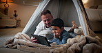 Tablet, child and father with bedroom fort for social media, video or online gaming app at home. Website, dad and boy together with bonding, streaming and movie with duvet and internet in a house