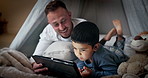 Tablet, boy and father with bedroom fort for social media, video or online gaming app at home. Website, dad and family together with bonding, streaming and movie with duvet and internet in a house