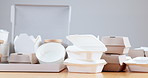 Closeup, restaurant and empty boxes for food, pizza or delivery with sustainable material on table. Paper packaging, supply chain and eco friendly container for meal, product and e commerce in cafe